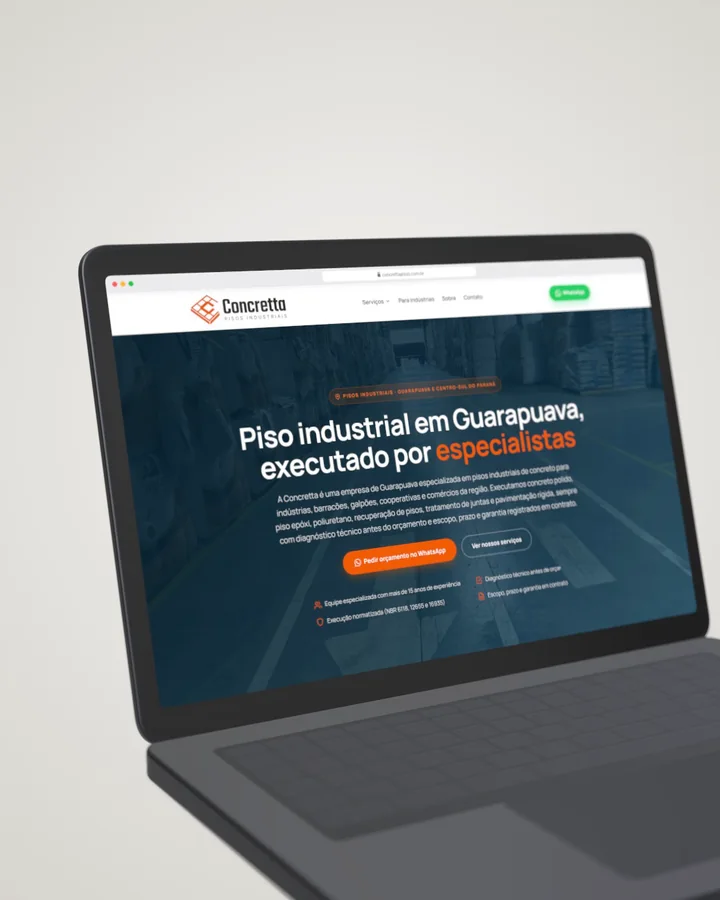 Site Concretta Pisos aberto em um notebook
